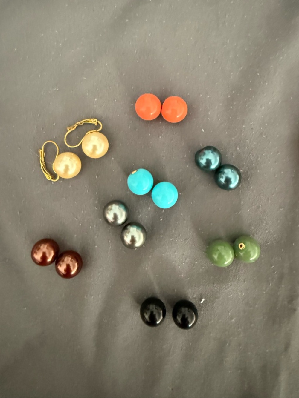 Joan Rivers cushion set wire earrings with 8 pairs of colored balls.